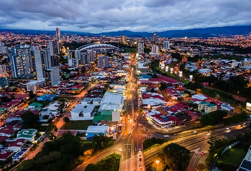 Aerial view of San José, Costa Rica at dusk showcases an emerging market destination for U.S. real estate investors seeking international property financing