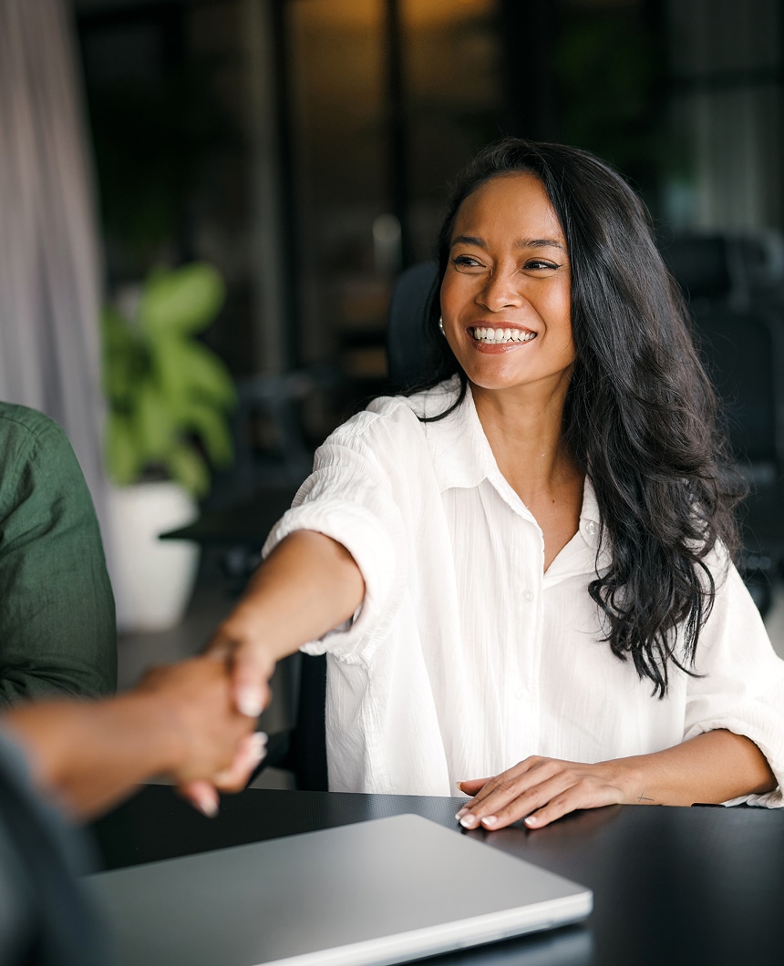 Friendly handshake symbolizing trusted support for U.S. buyers seeking Costa Rica real estate financing through personalized international home loans.